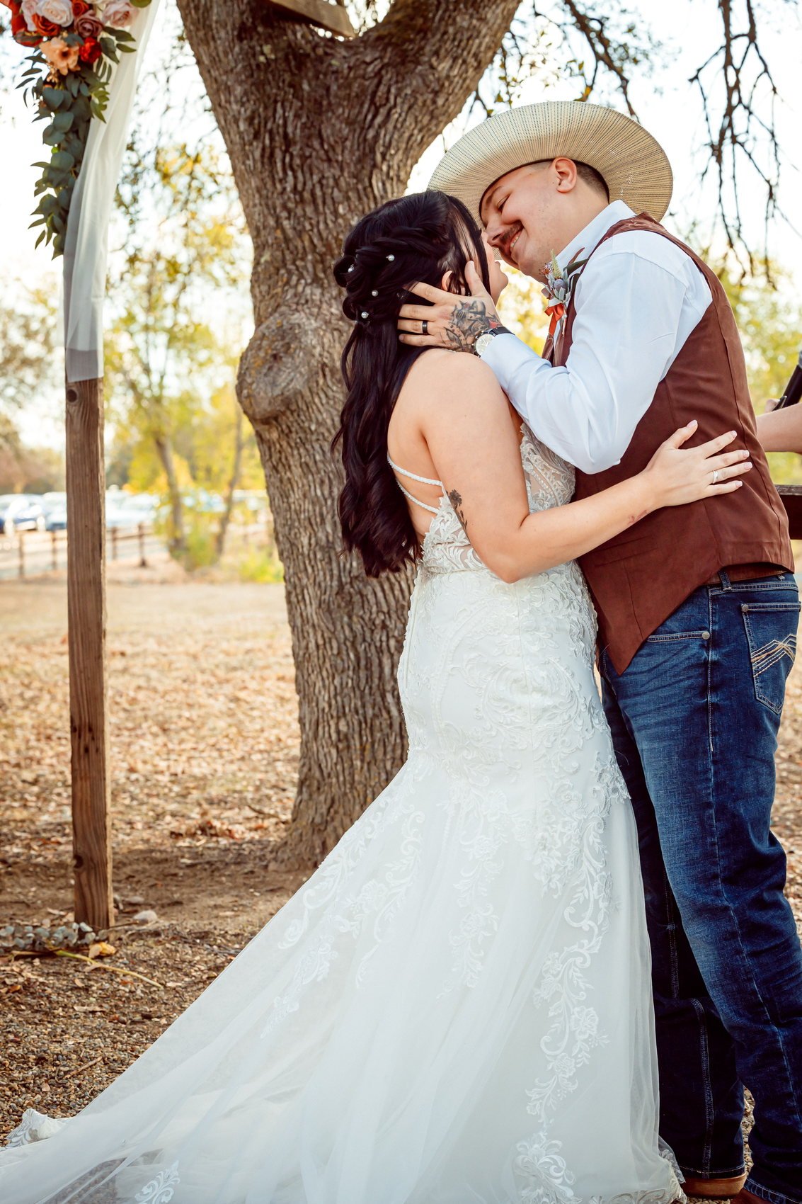 Bride and groom under an oak at their Central Valley wedding