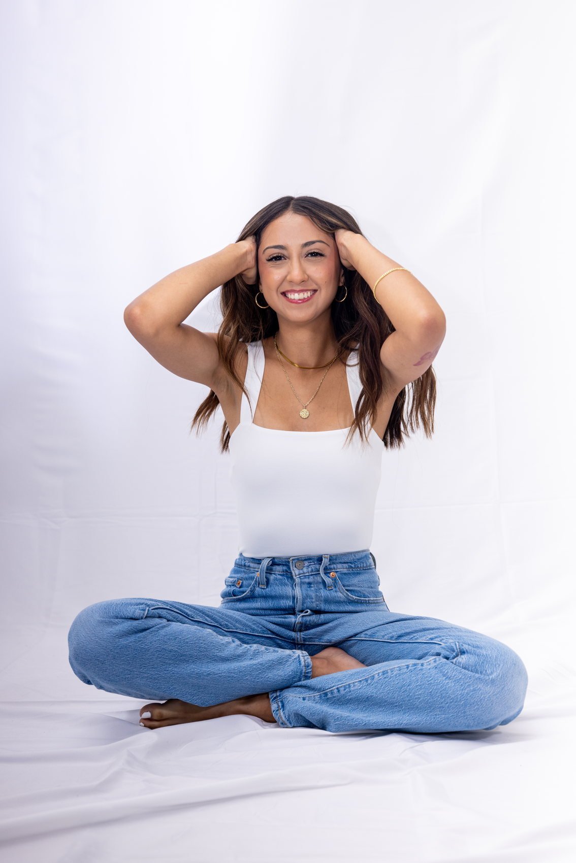 Studio portrait on a plain backdrop